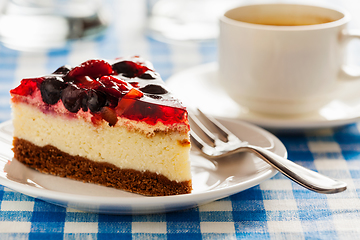 Image showing Cake on plate with fork and coffee cup