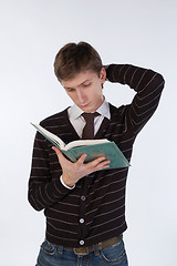 Image showing Young man reading a book