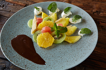 Image showing Bowl of healthy fresh fruit salad fruit with chocolate