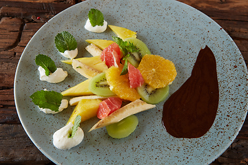 Image showing Bowl of healthy fresh fruit salad fruit with chocolate