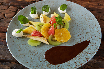 Image showing Bowl of healthy fresh fruit salad fruit with chocolate