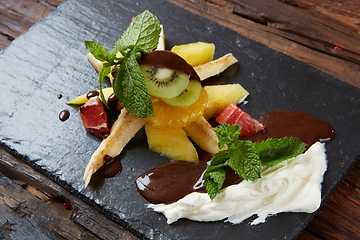 Image showing Bowl of healthy fresh fruit salad fruit with chocolate