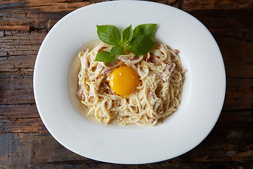 Image showing Pasta Carbonara on white plate with parmesan