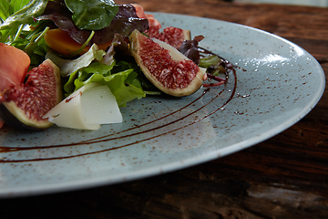 Image showing Italian salad. From figs with jamon and parmesan.