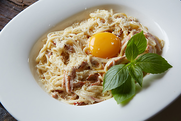 Image showing Pasta Carbonara on white plate with parmesan