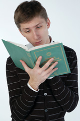 Image showing Young man reading a book