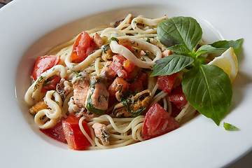 Image showing Seafood pasta Spaghetti with Clams, Prawns, Seafood Cocktail close up