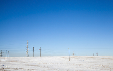 Image showing Snow Sunny snow electric poles