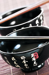 Image showing Rice bowls and chopsticks