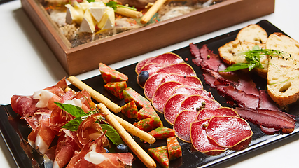 Image showing Antipasto Platter Cold meat plate with grissini breadsticks.