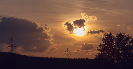 Image showing summer sunset with electricity tower