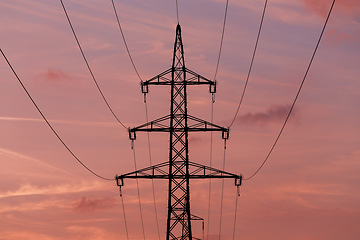 Image showing summer sunset with electricity tower