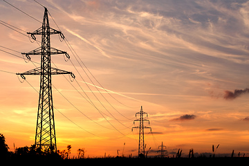 Image showing summer sunset with electricity tower