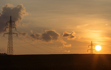 Image showing summer sunset with electricity tower