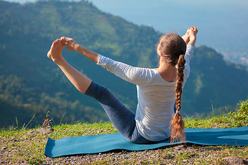 Image showing Yoga outdoors in mountains