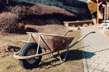 Image showing old rusty garden wheelbarrow
