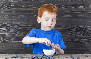 Image showing blueberry and boy