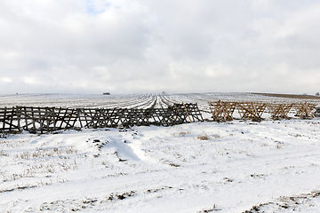 Image showing Wooden fences in the field