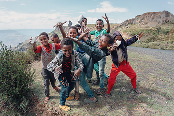 Image showing Ethiopian teenager boys posing to tourists