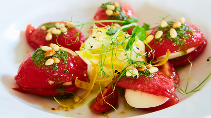Image showing Mozzarella and tomato salad - caprese on the white plate. Shallow dof