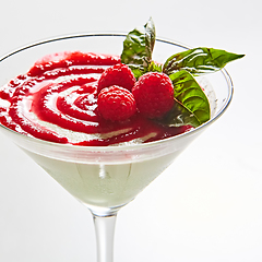 Image showing Delicious Italian dessert Panna Cotta with raspberry in small transparent glass