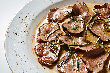 Image showing Fried beef tongue with coarse salt. Grilled beef tongue.