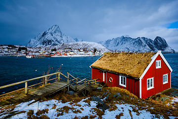 Image showing Traditional red rorbu house in Reine village on Lofoten Islands,