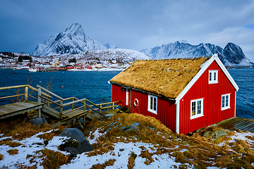 Image showing Traditional red rorbu house in Reine village on Lofoten Islands,