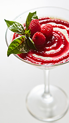 Image showing Delicious Italian dessert Panna Cotta with raspberry in small transparent glass