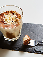 Image showing Tiramisu in glass, traditional coffee flavored Italian dessert made of ladyfingers and mascarpone.