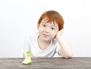 Image showing the boy is tired of the apple