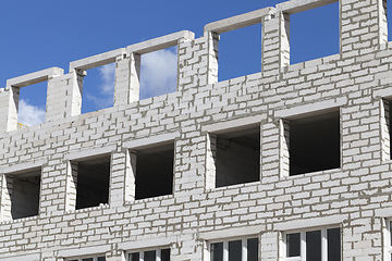 Image showing Brick building construction unfinished windows