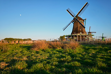 Image showing Windmills at Zaanse Schans in Holland on sunset. Zaandam, Nether