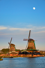 Image showing Windmills at Zaanse Schans in Holland in twilight on sunset. Zaa