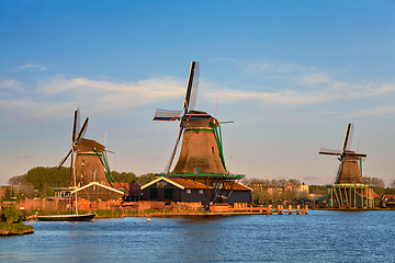 Image showing Windmills at Zaanse Schans in Holland in twilight on sunset. Zaa