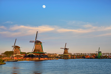 Image showing Windmills at Zaanse Schans in Holland in twilight on sunset. Zaa