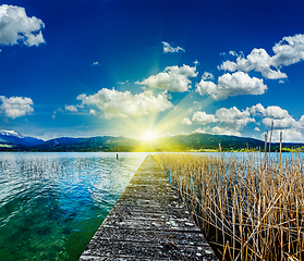 Image showing Pier in the lake, countryside on sunset