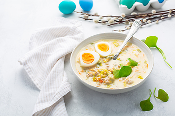 Image showing Traditional Polish sour soup Zurek in ceramic bowl  for Easter