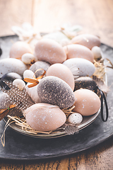 Image showing Easter eggs with pussy-willow branch on wooden kitchen table