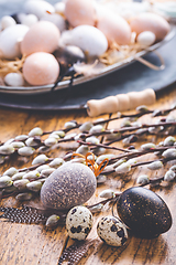 Image showing Easter eggs with pussy-willow branch on wooden kitchen table