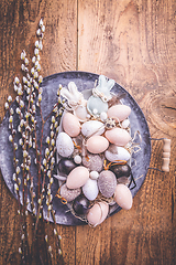 Image showing Easter eggs with pussy-willow branch on wooden kitchen table