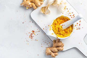 Image showing Homemade Fresh Ginger and Garlic paste or Adrak Lahsun puree in ceramic bowl