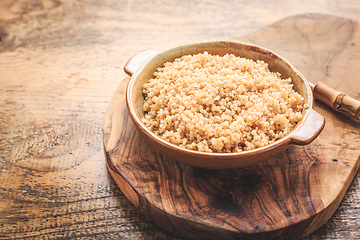 Image showing Healthy colorful cooked quinoa. Superfood, gluten-free food on wooden background