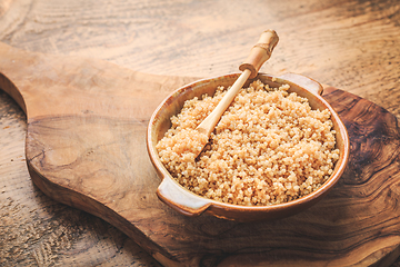 Image showing Healthy colorful cooked quinoa. Superfood, gluten-free food on wooden background