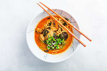 Image showing Thai red curry noodle soup with shiitake,  coconut milk and onions