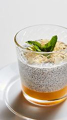 Image showing Mango yogurt with chia seeds for healthy breakfast on a white background