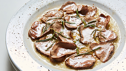 Image showing Fried beef tongue with coarse salt. Grilled beef tongue.