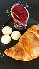 Image showing Closeup of butter, jam and fresh croissants