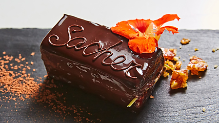 Image showing A piece of Sacher cake. Shallow dof.