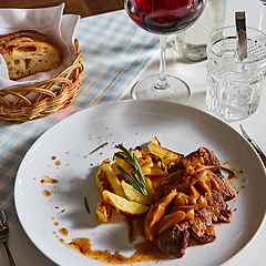 Image showing The potatoes fried with mushrooms and beef.